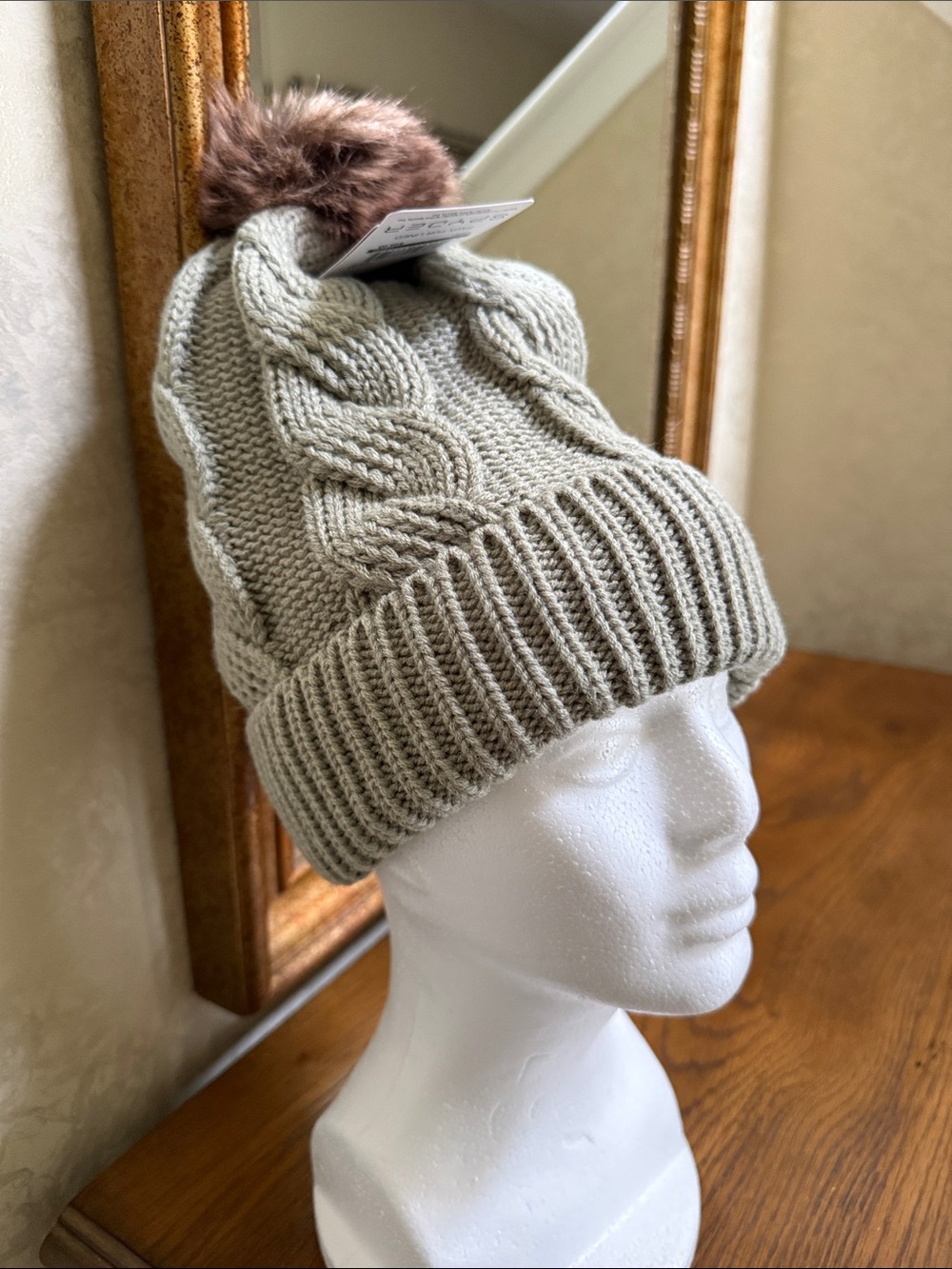 Spyder Cable Knit Hat Pom Beanie in green with Brown Pom and faux fur lining. OS